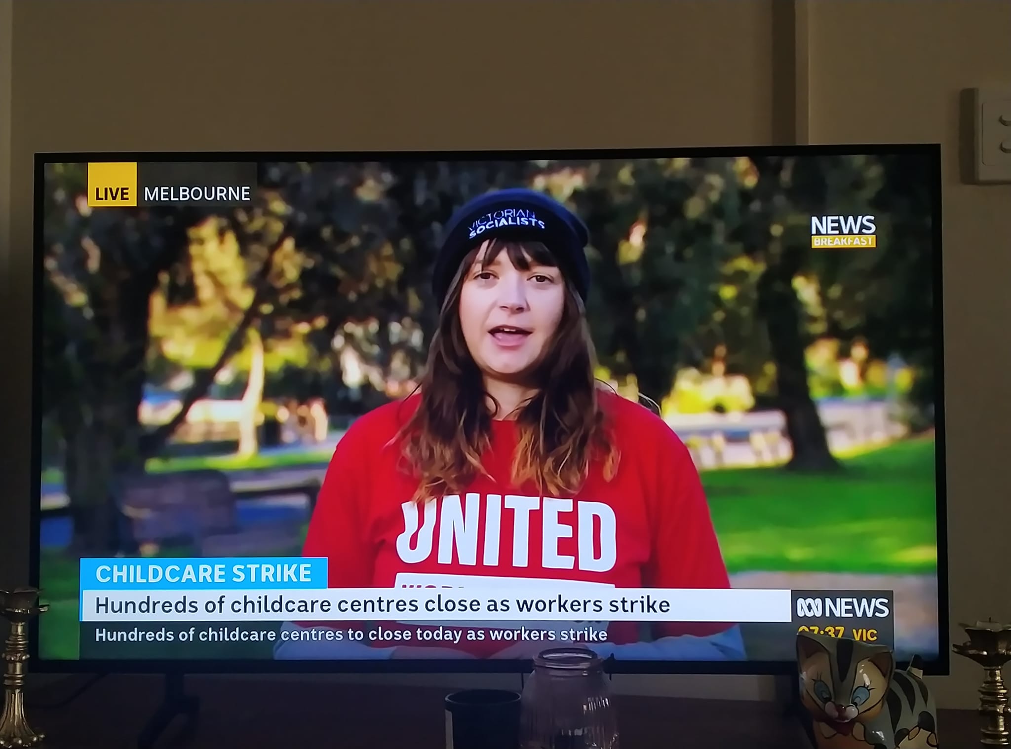 Victorian Socialists member and early childhood educator Ruby Healer speaks to ABC News on the morning of the rally