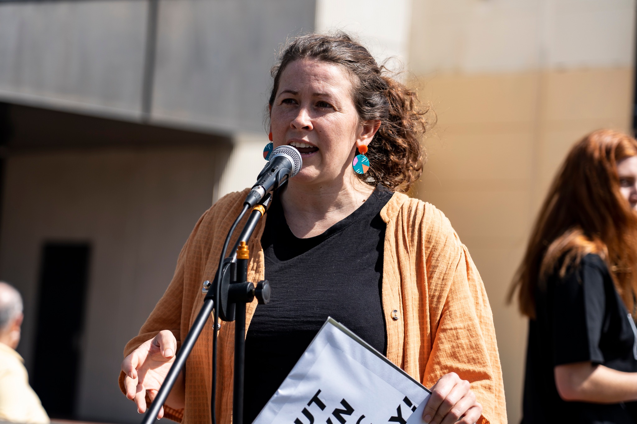 Victorian Socialists Western Metro candidate Liz Walsh speaks at the rally