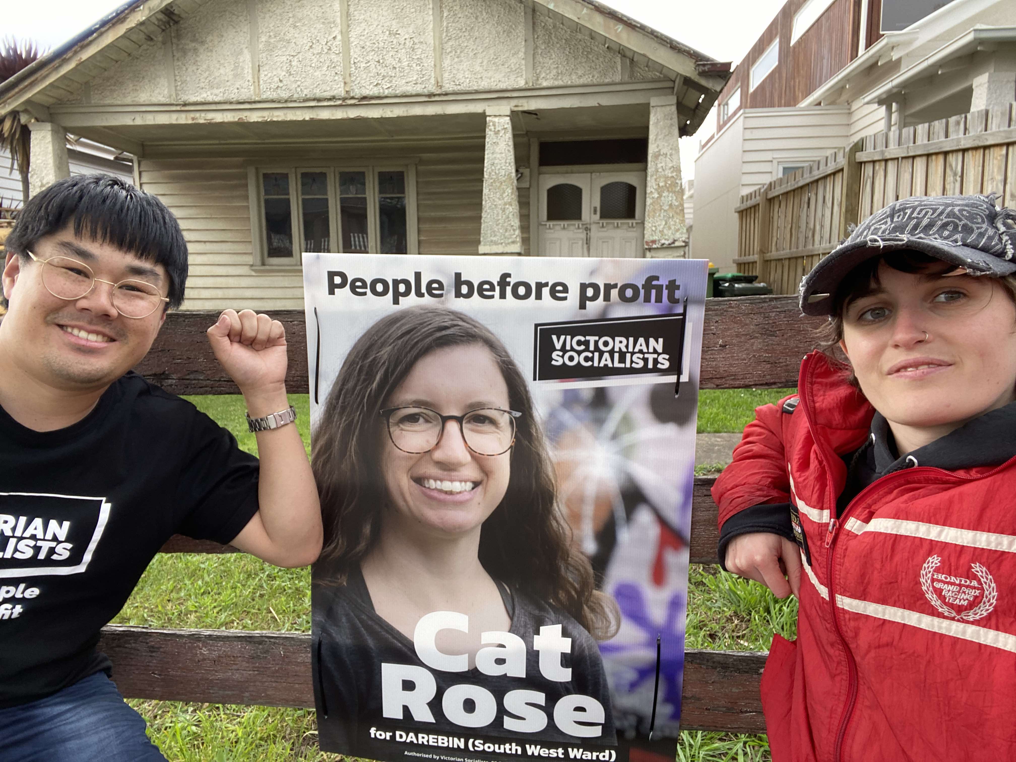 VS volunteers put up a yard sign in Darebin