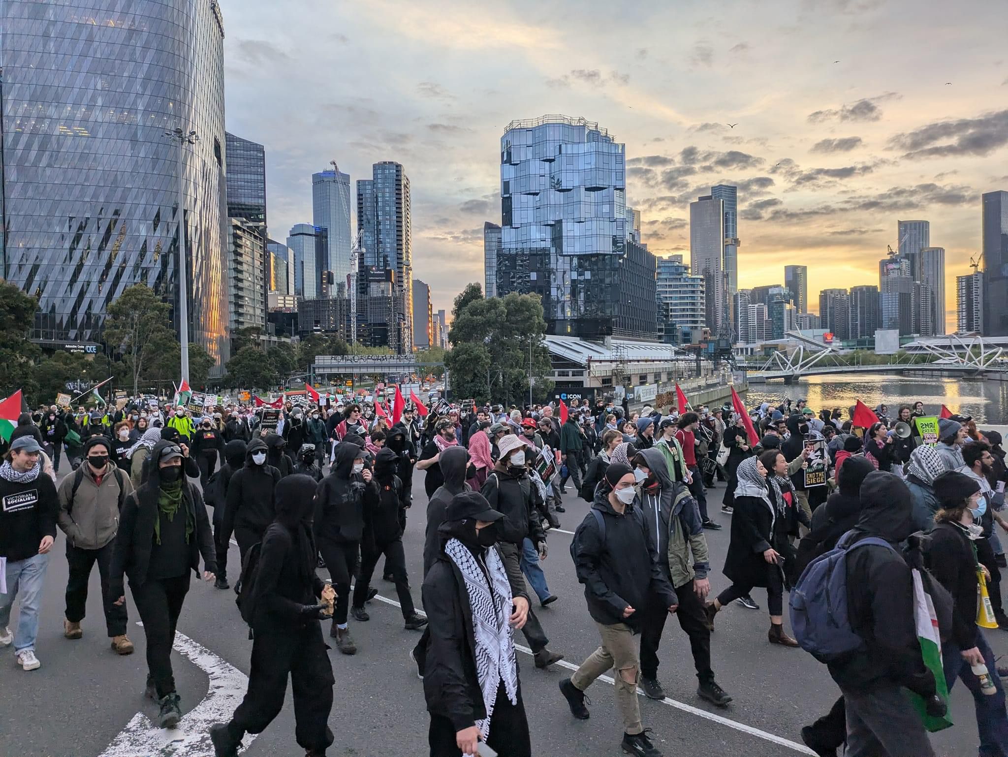 Land Forces protestors with red flags