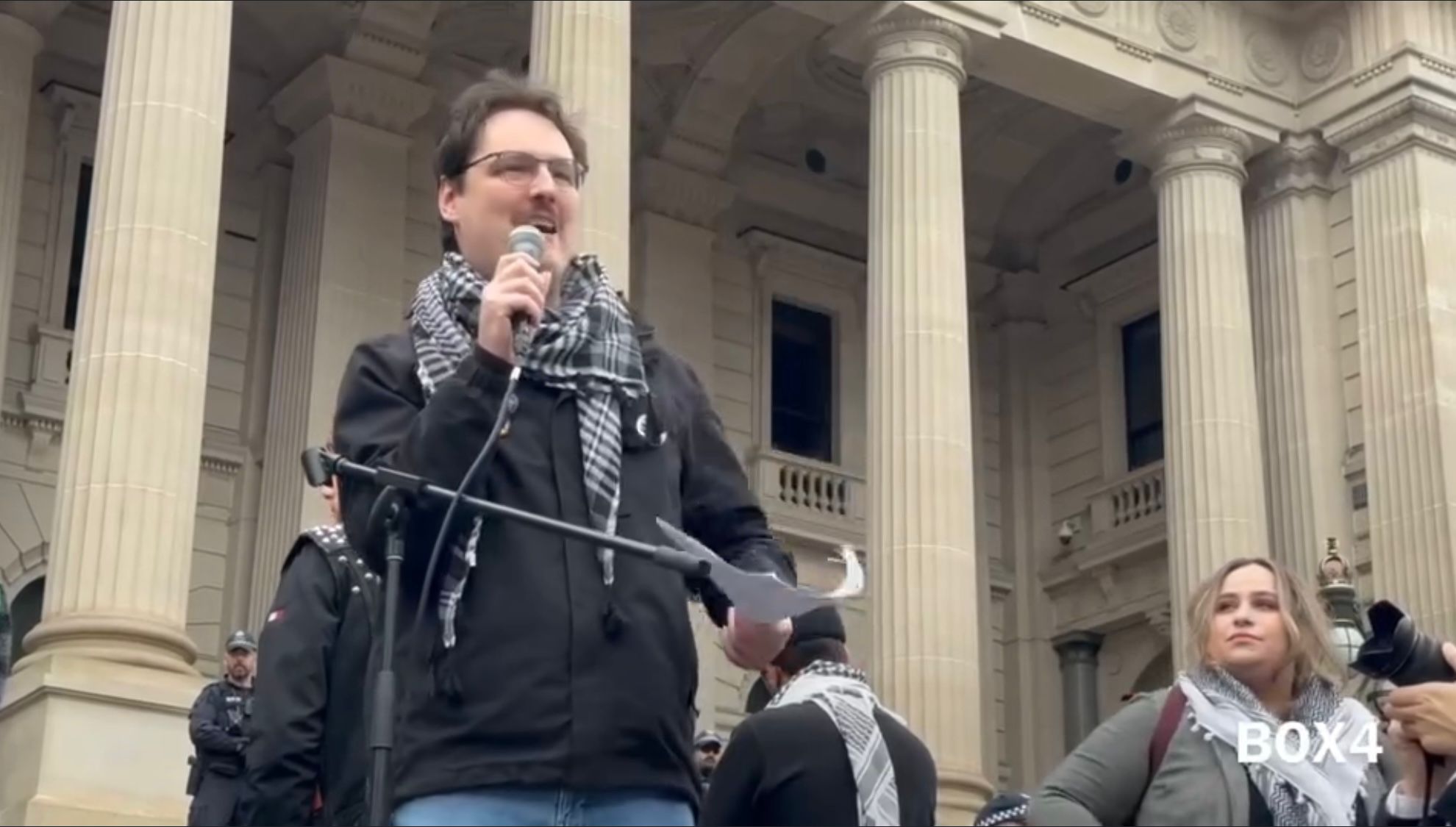 Lucas speaking at the Sunday rally